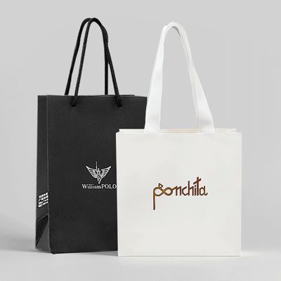 Roupas de luxo Bolsas de compras de papel Bolsas de presente brancas com alças de fita